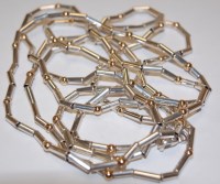 Lot 495 - A modern silver tubular link necklace, having...