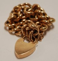 Lot 514 - A 9ct gold hollow curblink bracelet with...