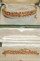 Lot 515 - A 15ct gold, ruby and seed pearl set hinged...