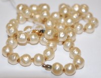 Lot 522 - A Ciro knotted pearl single string necklace,...