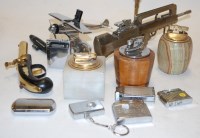 Lot 582 - A box of assorted lighters to include novelty...
