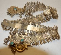 Lot 584 - An Indian ladies white metal and turquoise set...
