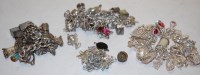 Lot 589 - A large collection of principally silver charm...