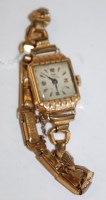 Lot 542 - A Ramex 18ct gold ladies tank watch, having...