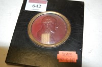Lot 642 - A pressed metal portrait plaque of Napoleon in...