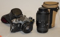 Lot 713 - A Pentax MX camera in leather case; together...