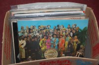 Lot 788 - A box of popular LPs to include; The Beatles,...