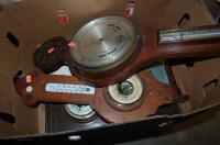 Lot 861 - An early 20th century carved oak barometer...