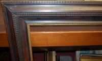 Lot 1011 - A Swedish ebonised and gilded moulded wooden...