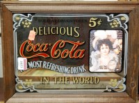 Lot 1033 - A small Coca-Cola advertising wall mirror; two...