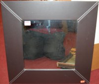 Lot 1087 - A modern leather framed wall mirror,...