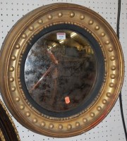 Lot 1110 - A 19th century giltwood circular convex wall...