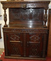 Lot 1126 - An antique low relief floral carved and...