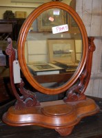 Lot 1176 - A mid Victorian mahogany oval swing dressing...