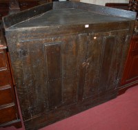 Lot 1177 - An antique oak metal bound double door corner...