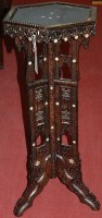 Lot 1179 - A North African low relief carved hardwood and...