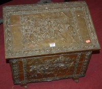 Lot 1184 - A Dutch embossed brass hinge top fuel depot