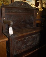 Lot 1196 - An early 20th century low relief carved oak...