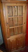 Lot 1152 - A modern pine barrel back freestanding corner...