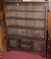 Lot 1198 - An early 20th century low relief carved oak...