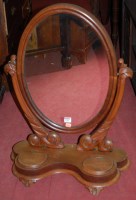 Lot 1199 - A mid-Victorian mahogany oval swing dressing...