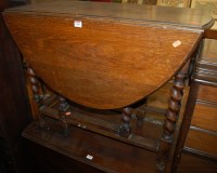 Lot 1200 - A 1930s barleytwist oak dropleaf dining table,...