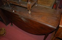 Lot 1202 - An early George III mahogany dropleaf dining...