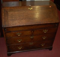 Lot 1213 - A George III oak and mahogany crossbanded...