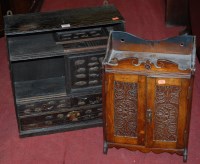 Lot 1227 - A Chinese ebonised elm table-top cabinet;...