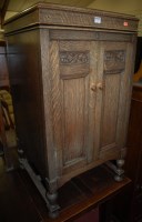 Lot 1230 - An early 20th century moulded oak hinge-top...