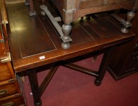 Lot 1231 - A 1930s oak drawerleaf dining table