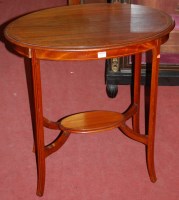 Lot 1237 - An Edwardian walnut and satinwood strung oval...