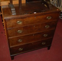 Lot 1240 - An early 19th century oak chest of four long...
