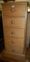 Lot 1248 - A modern and narrow pine chest of five drawers
