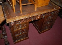 Lot 1258 - A circa 1900 low relief heavily carved oak...