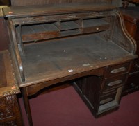 Lot 1260 - An early 20th century oak rolltop single...