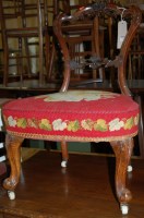 Lot 1269 - A Victorian walnut balloon back single salon...
