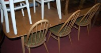 Lot 1272 - An Ercol light elm dining suite, comprising;...