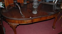 Lot 1276 - An early 20th century walnut extending dining...