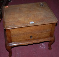 Lot 1287 - A 1930s walnut round cornered hinge-top sewing...