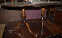Lot 1290 - A Regency style walnut twin pillar dining...