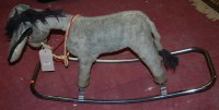 Lot 1293 - A childs upholstered rocking horse, raised on...