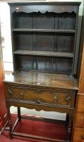 Lot 1144 - An early 20th century moulded oak dresser of...