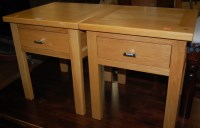 Lot 1315 - A pair of contemporary light oak single drawer...
