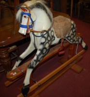 Lot 1320 - A mid-20th century dapple-grey rocking horse,...