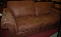 Lot 1325 - A contemporary tan suede upholstered three...