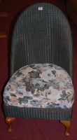 Lot 1327 - A Lloyd Loom green painted wicker low nursing...