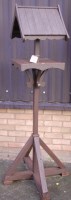 Lot 1137 - A stained wood freestanding garden birds house,...