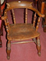 Lot 1340 - A late 19th century elm captain's chair;...