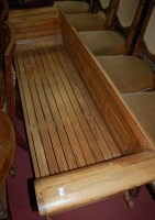 Lot 1346 - A contemporary hardwood slatted three seater...